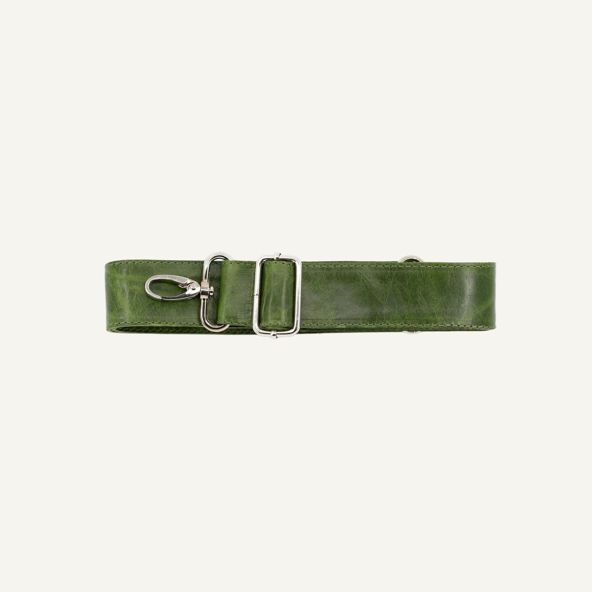 Green leather strap with silver clips on a white background
