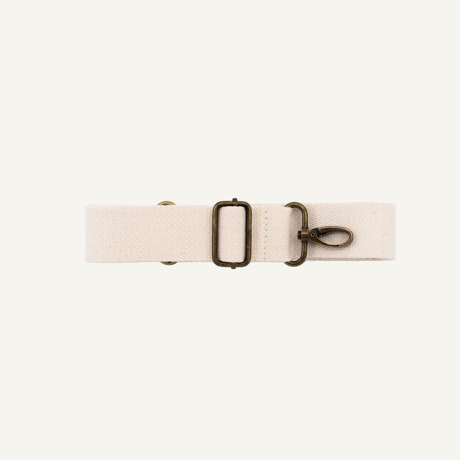 A cream cotton detachable strap with a metal clip for fanny packs.