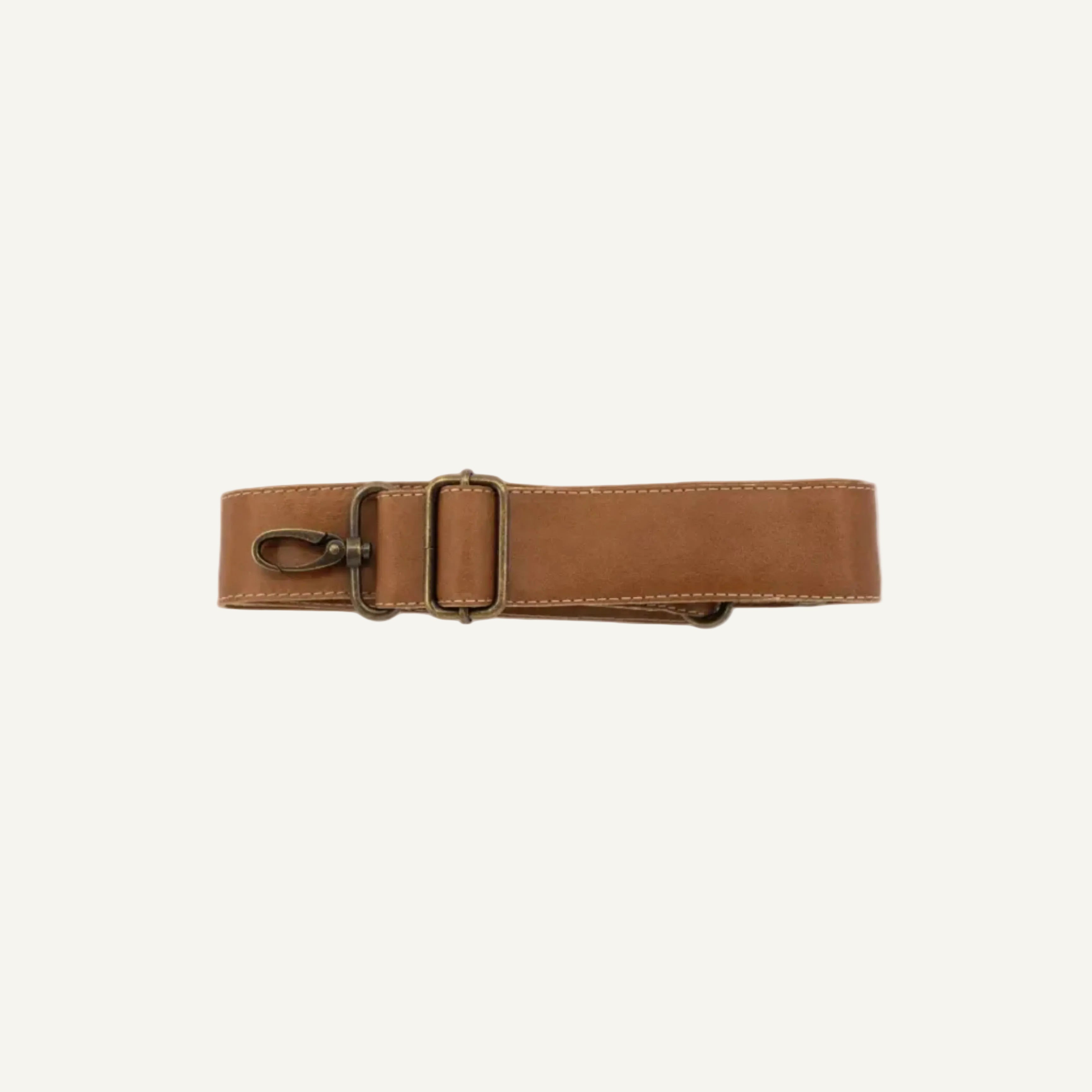 A brown leather belt with a brass buckle and a metal swivel snap hook, laid flat on a white background.