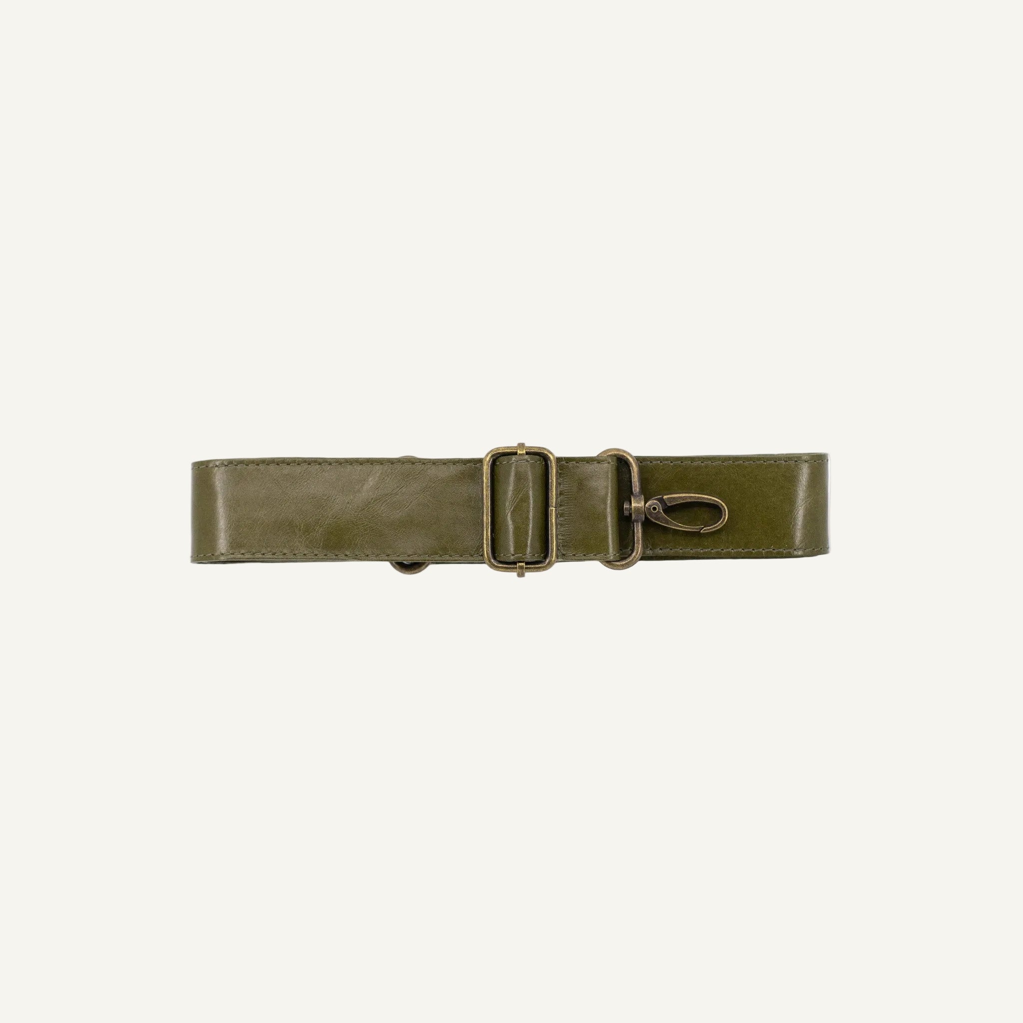 Green leather strap with a clips on a white background