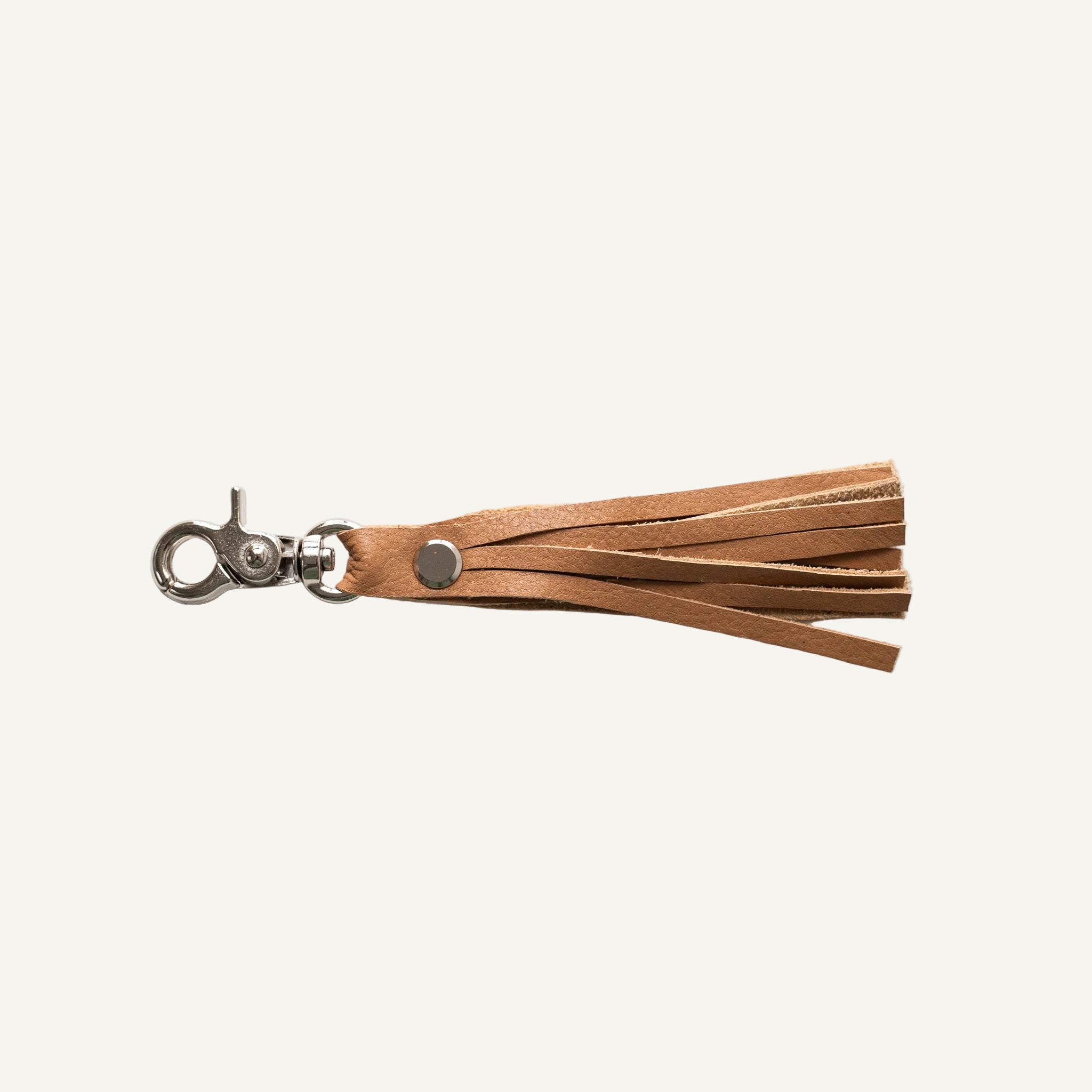Brown leather tassel keychain on a white background