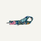 Floral patterned bag strap on a white background