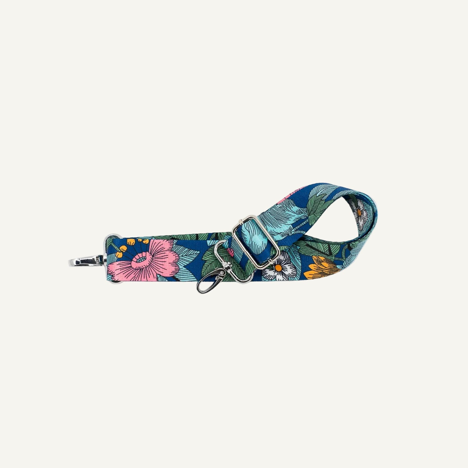 Floral patterned bag strap on a white background