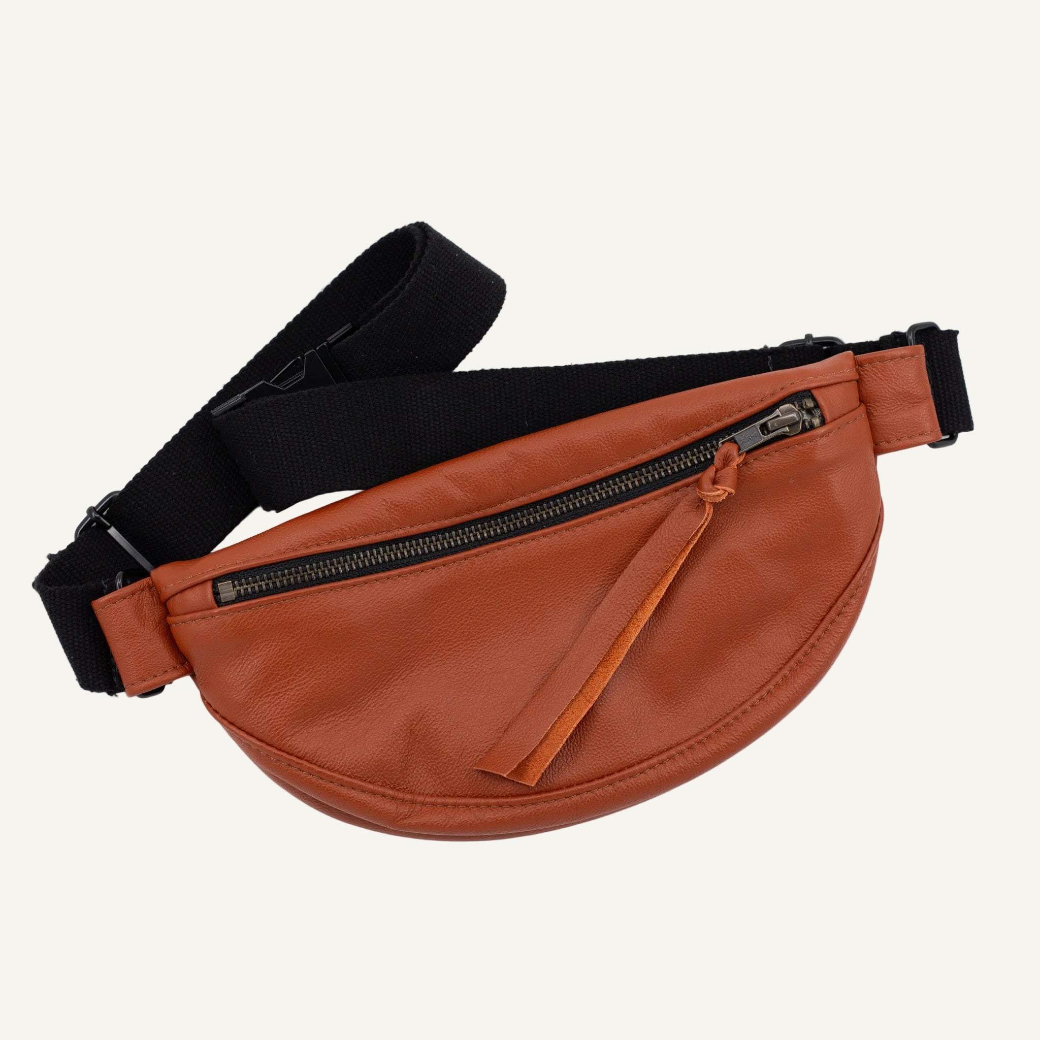 Brown fanny pack with a black strap on a white background