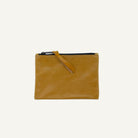 Brown leather pouch with a strap on a white background