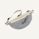 Gray waist bag with beige strap on a white background