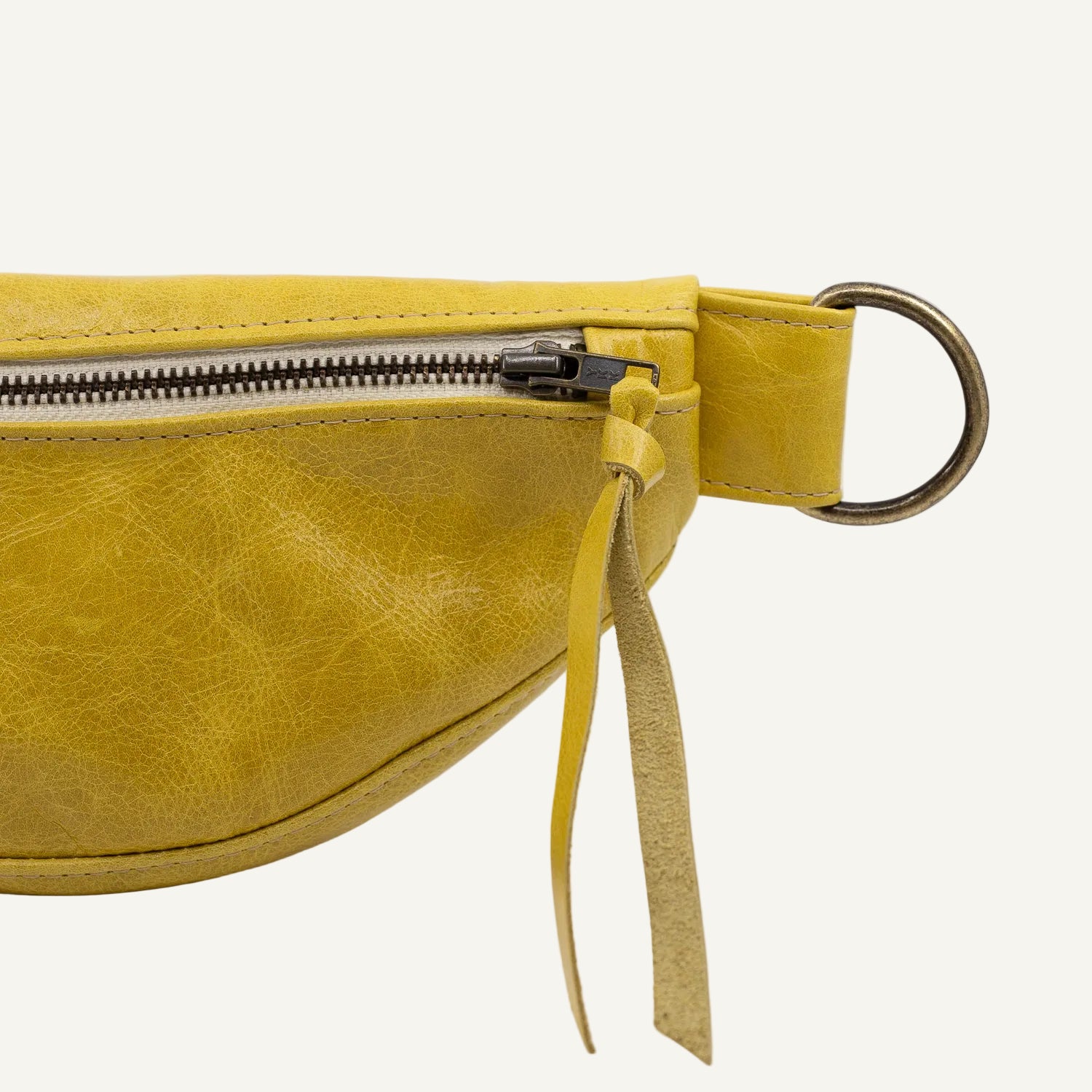 Yellow leather waist bag on a white background