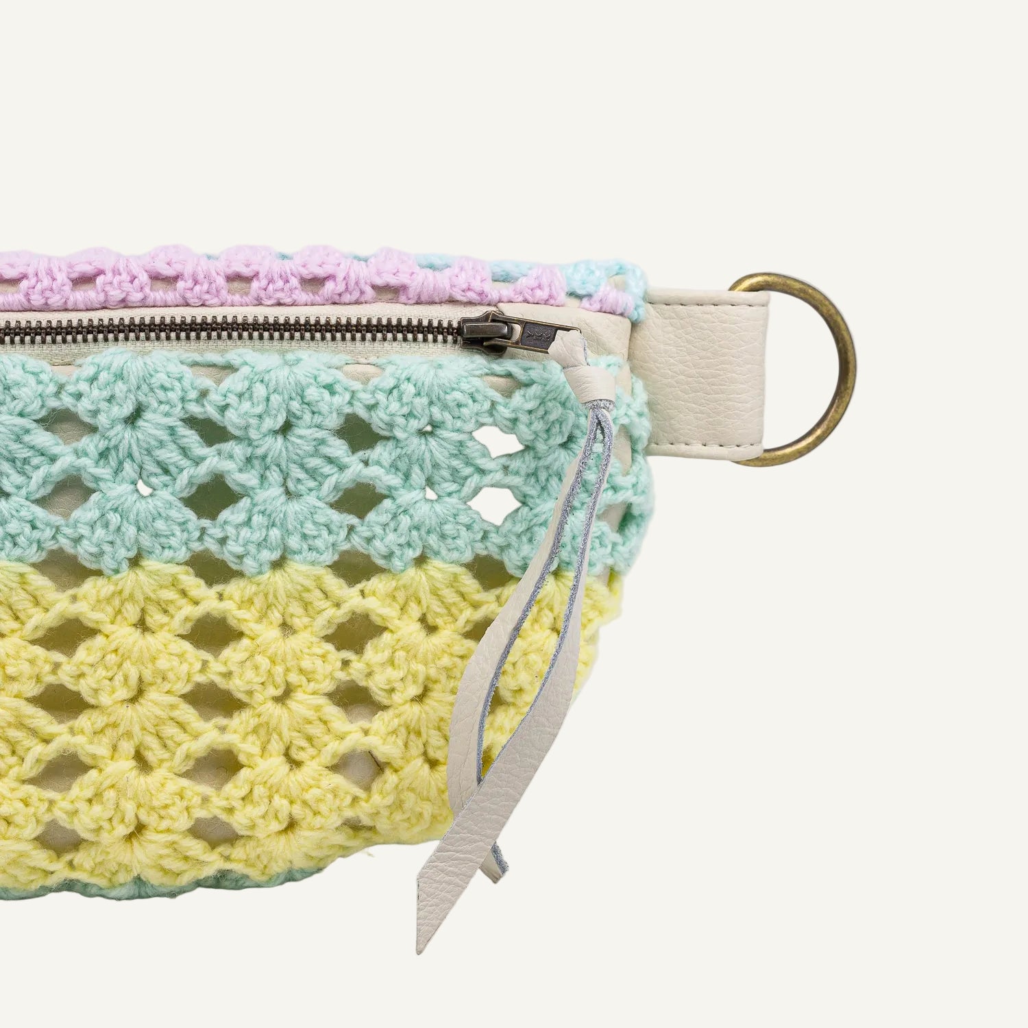 Crocheted pouch with a zipper on a white background