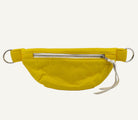 Yellow waist bag with a silver zipper on a white background