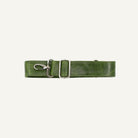 Green leather strap with silver clips on a white background