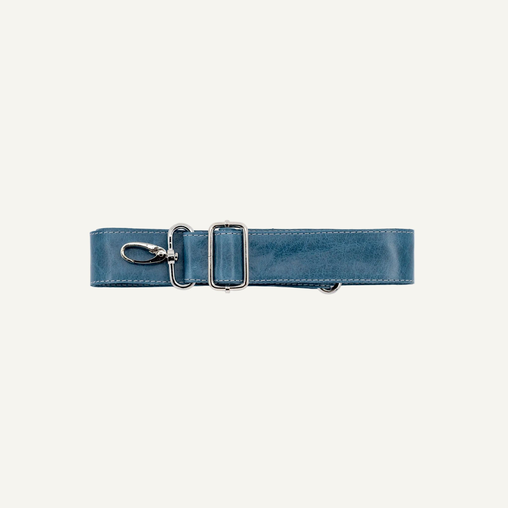 Blue leather strap with a silver clip on a white background