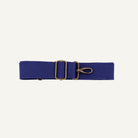Blue cotton strap with brass clip on a white background