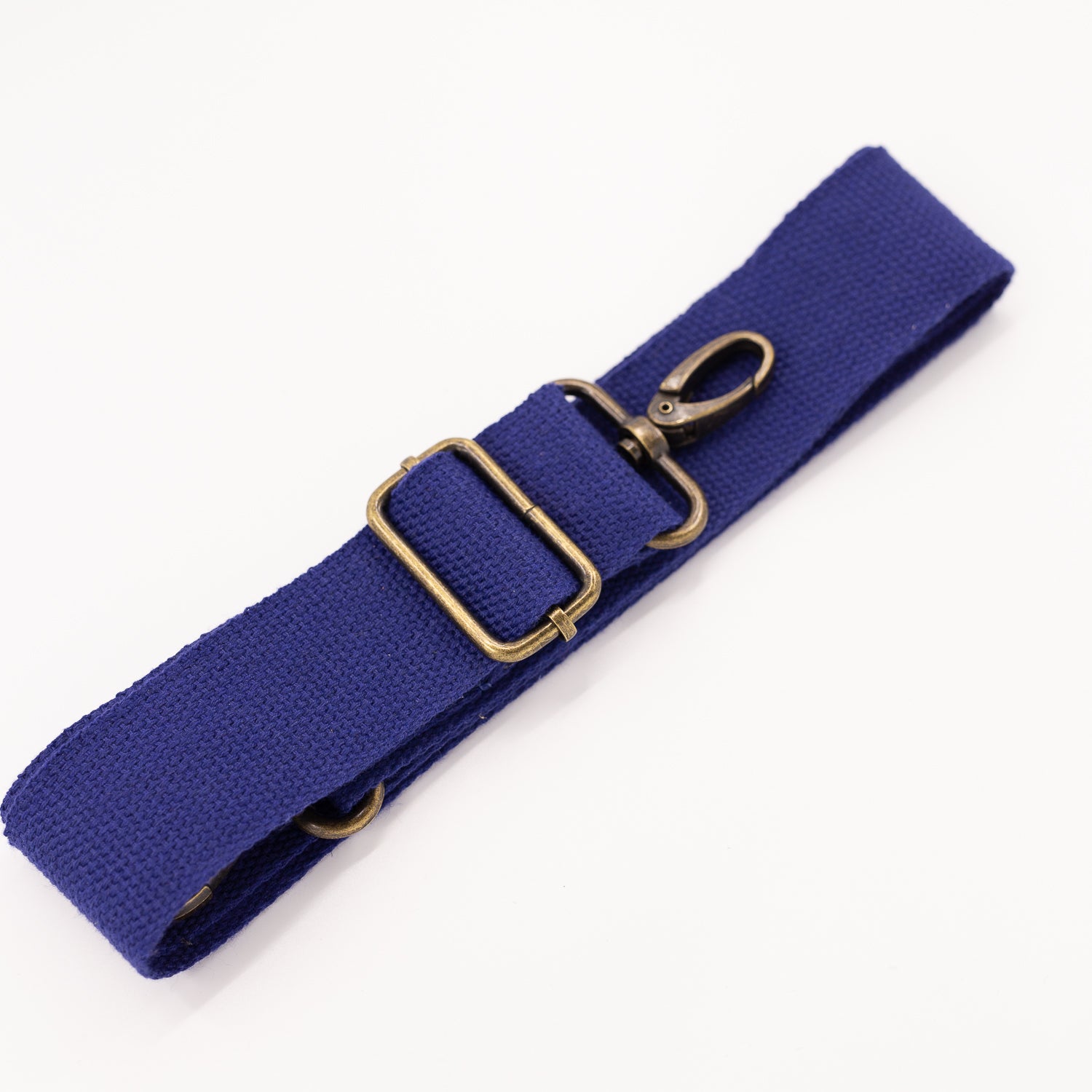 A blue cotton detachable strap with metal hardware for fanny packs.