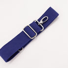 A blue cotton detachable strap with metal hardware for fanny packs.