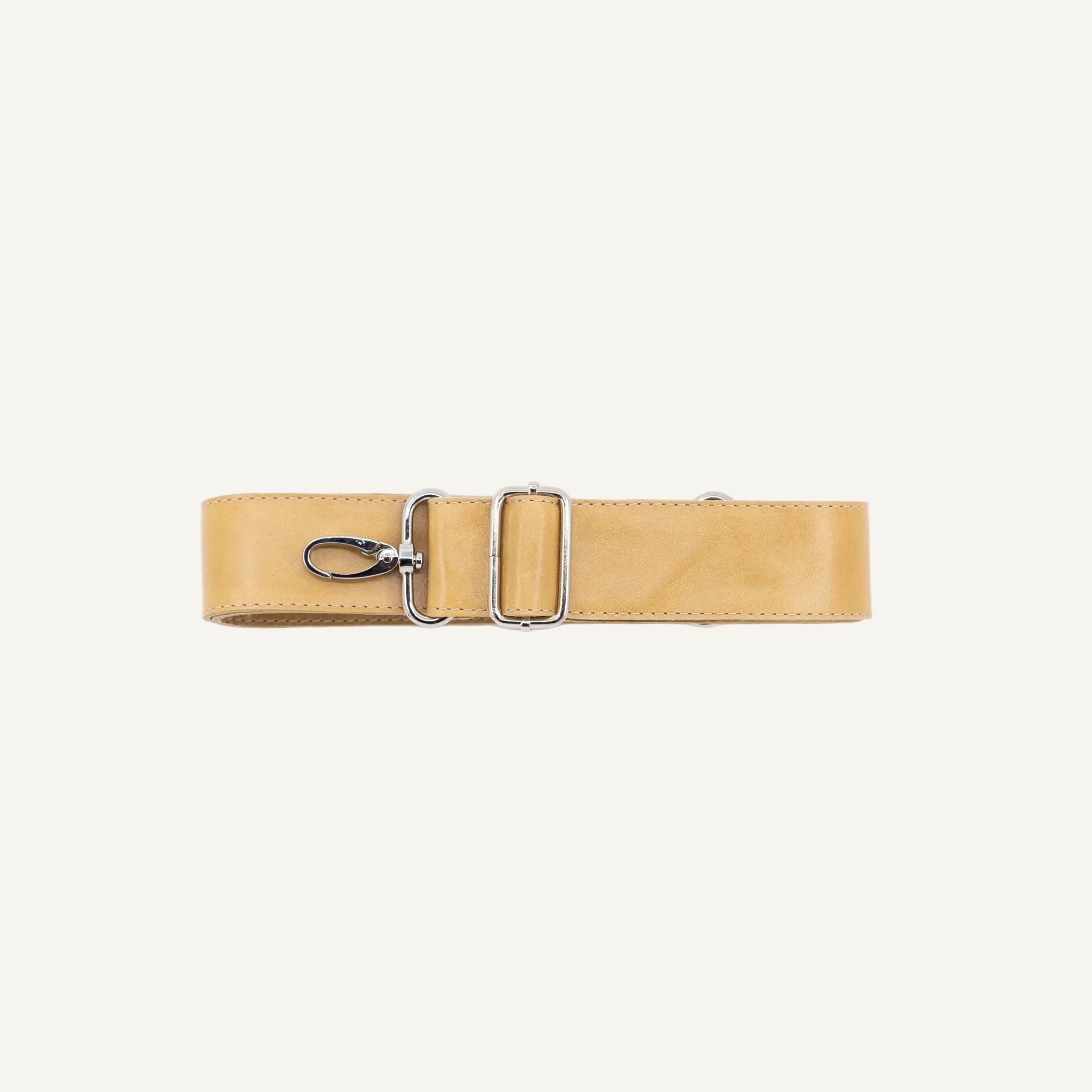 Beige strap with a silver clip on a white background