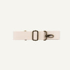 A cream cotton detachable strap with a metal clip for fanny packs.