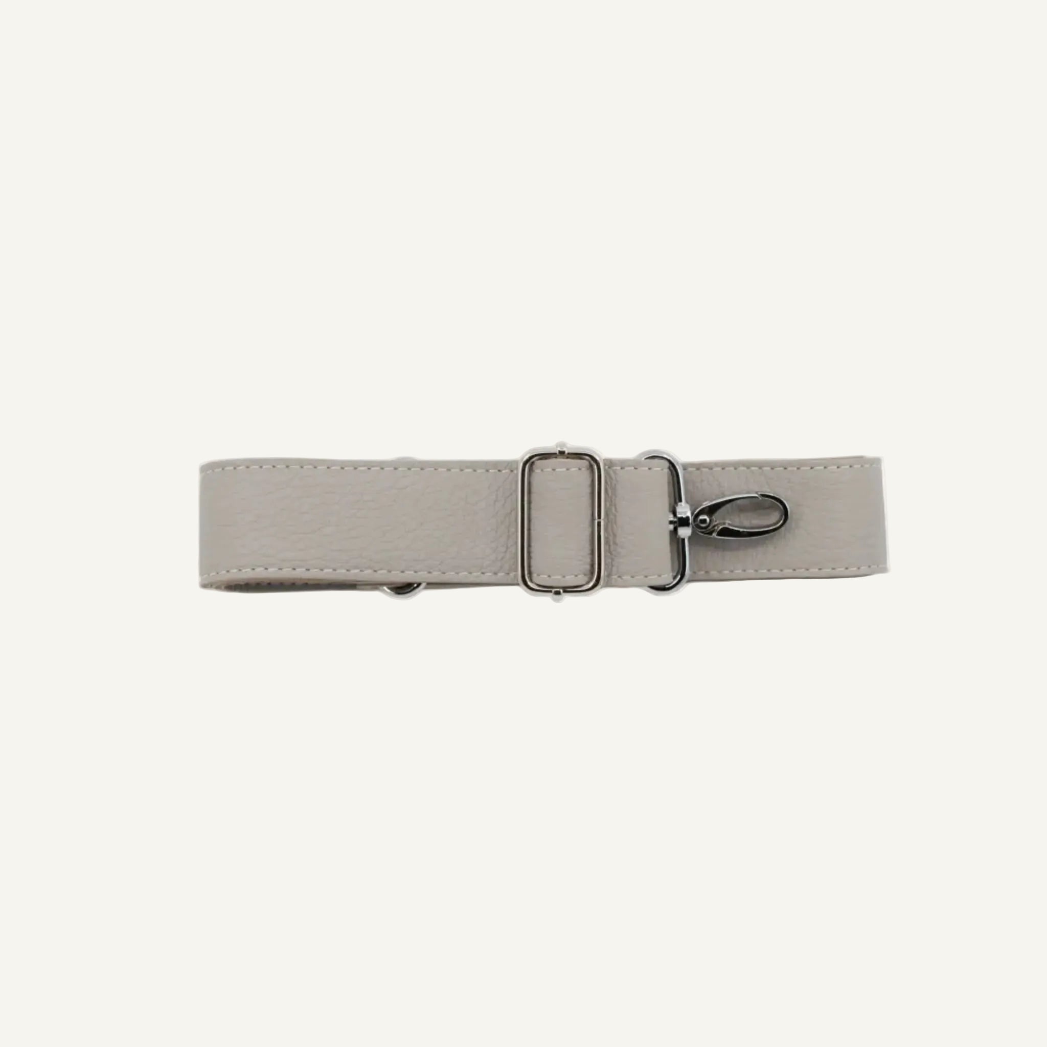 Beige belt with a silver buckle on a white background