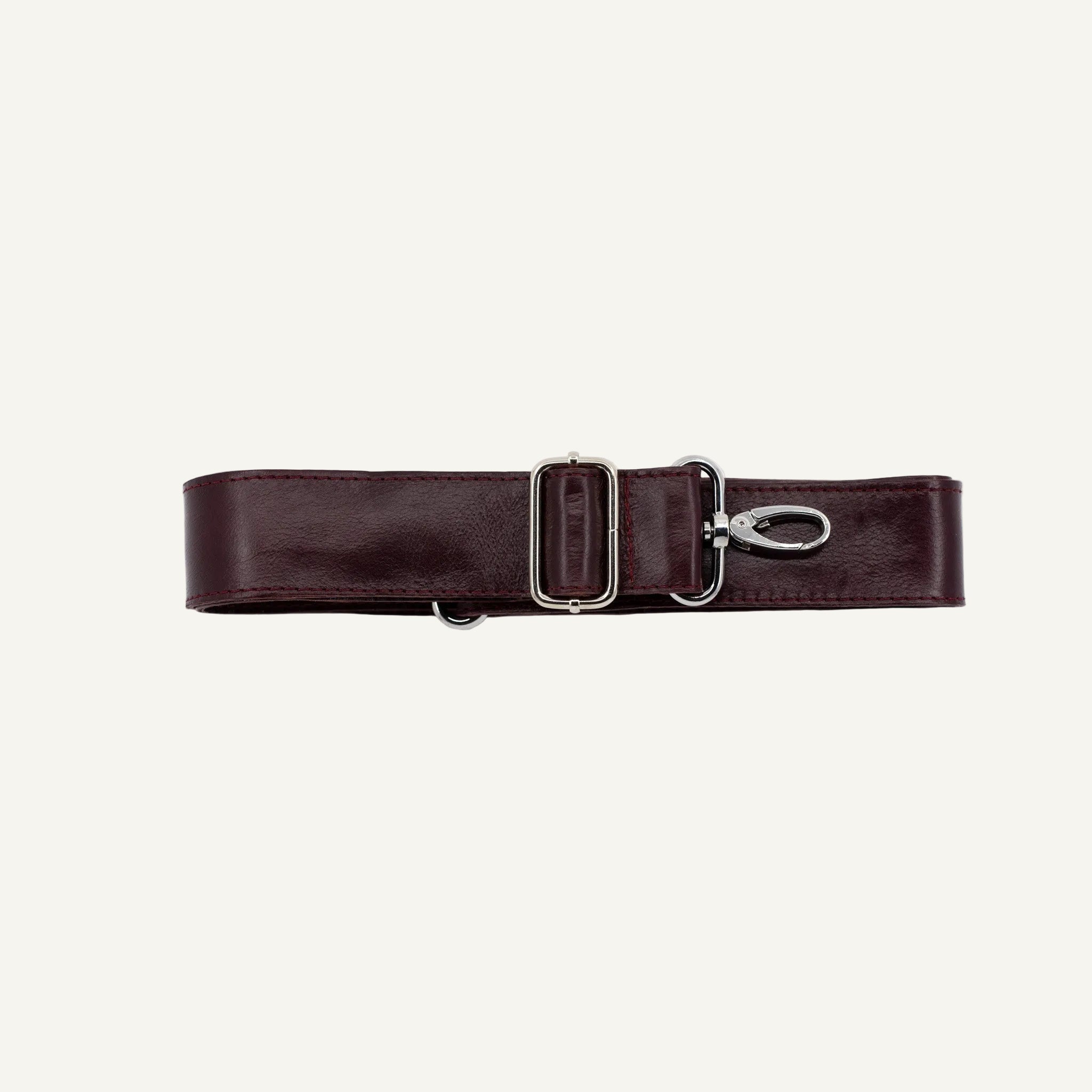 Maroon leather strap with silver clips on a white background