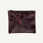Brown leather pouch with a zipper on a white background