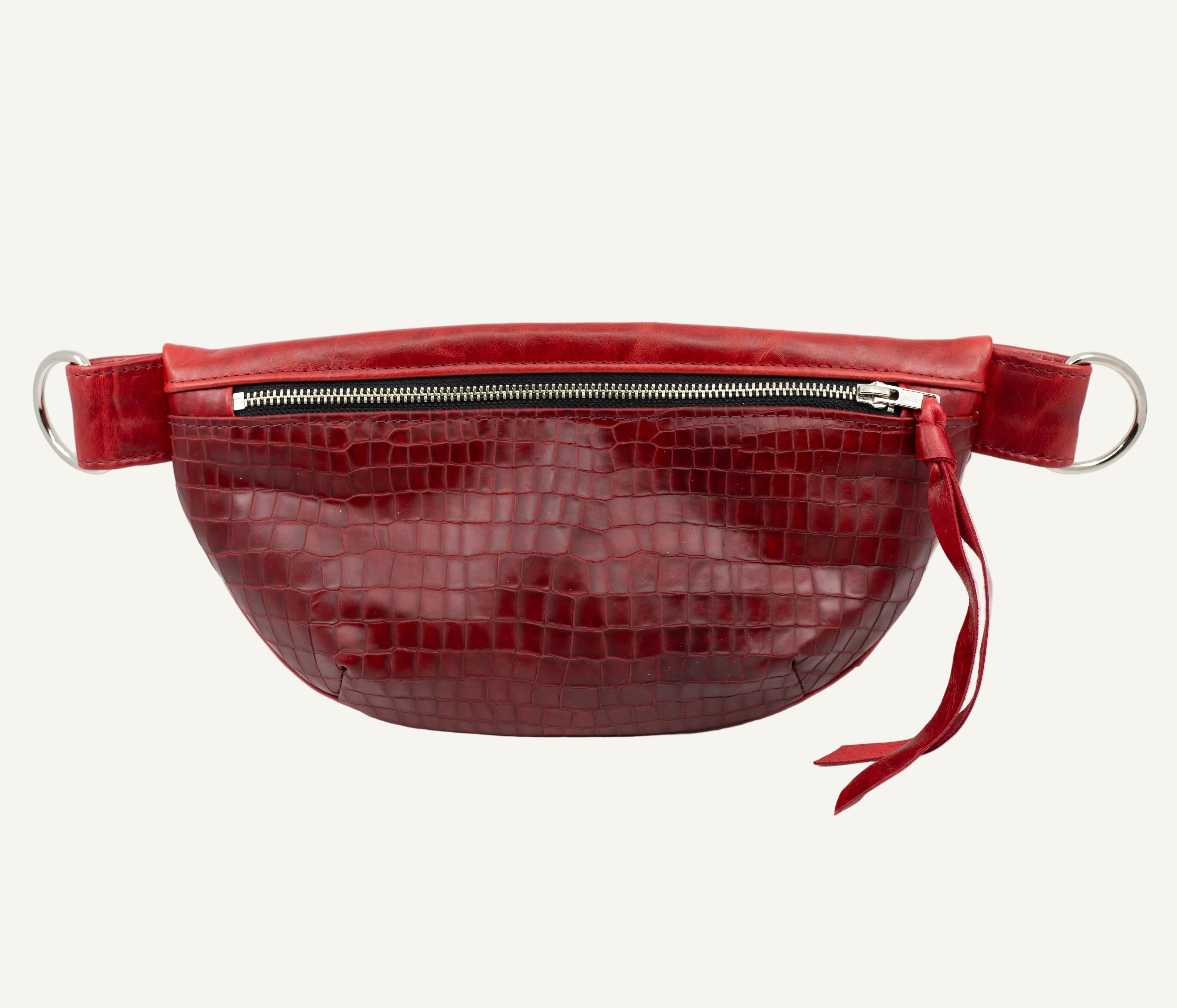 Red textured fanny pack on a white background