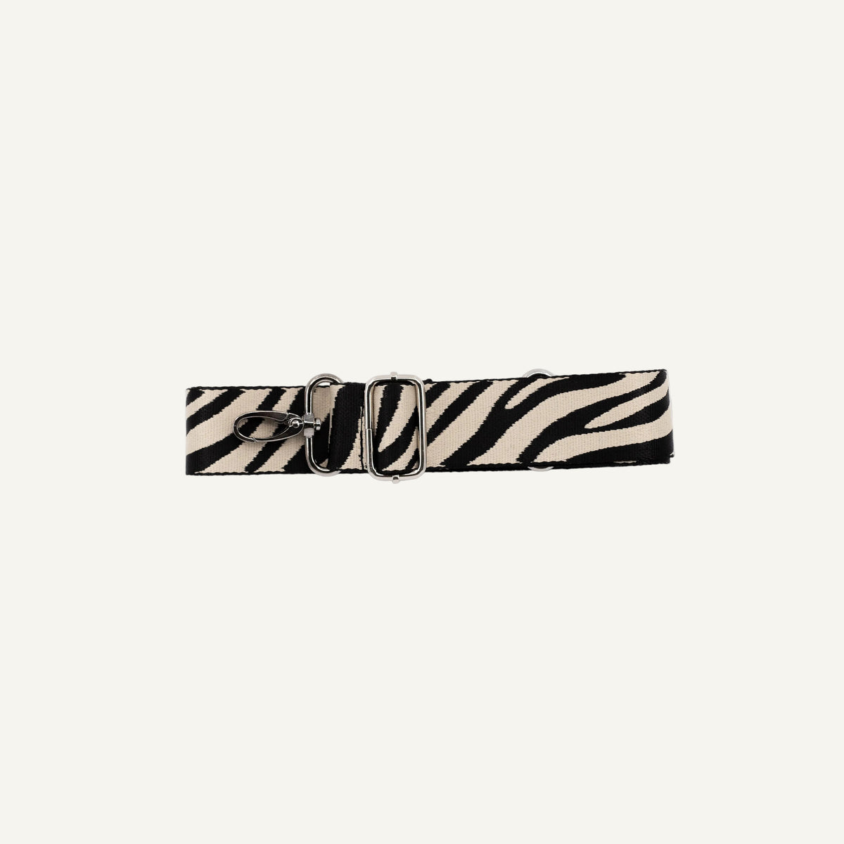 Zebra print strap with a silver clip on a white background