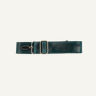 A dark teal green leather strap with a silver-toned metal clips, laid flat on a white background.