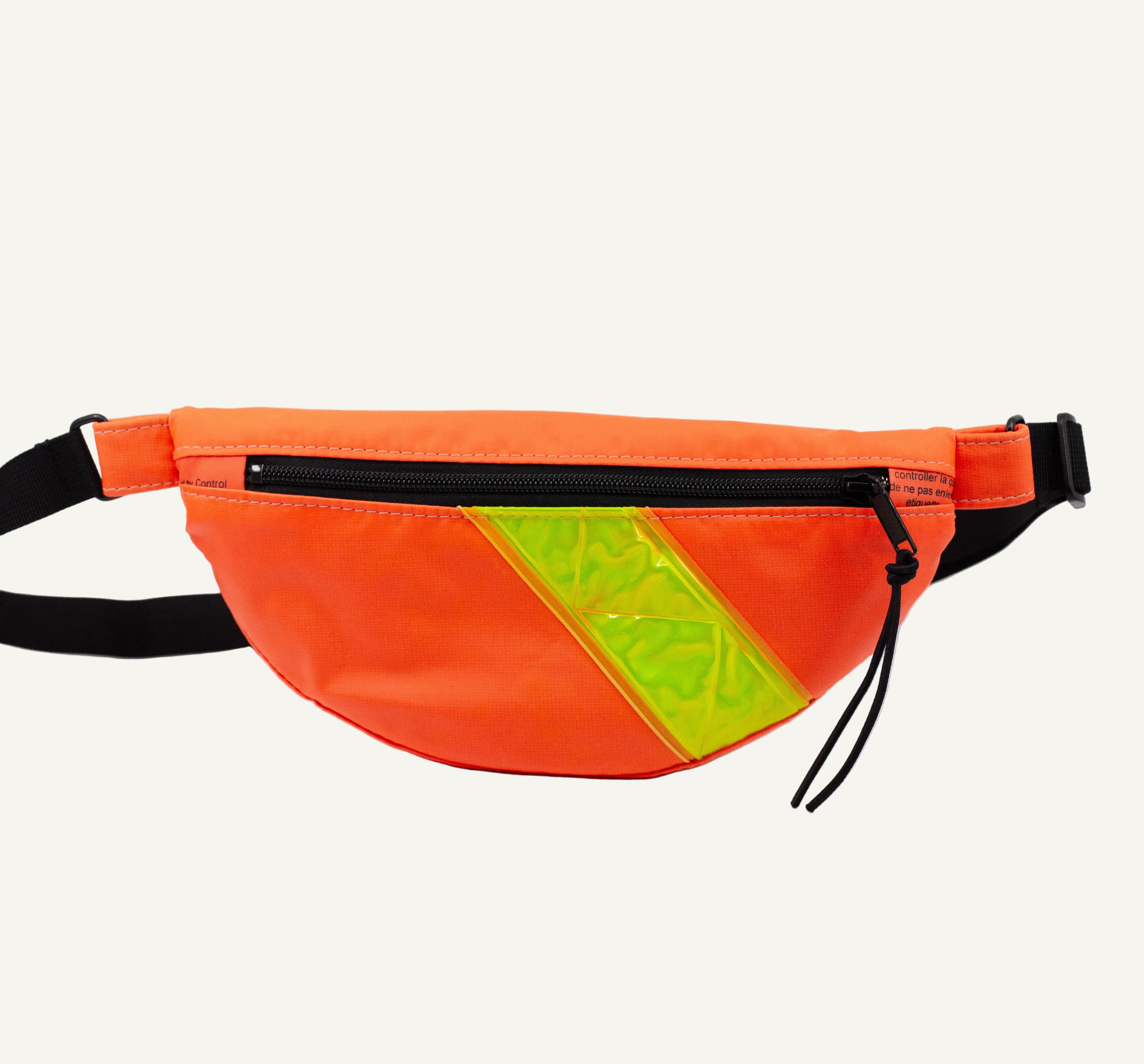 Orange fanny pack with a yellow reflective stripe on a white background