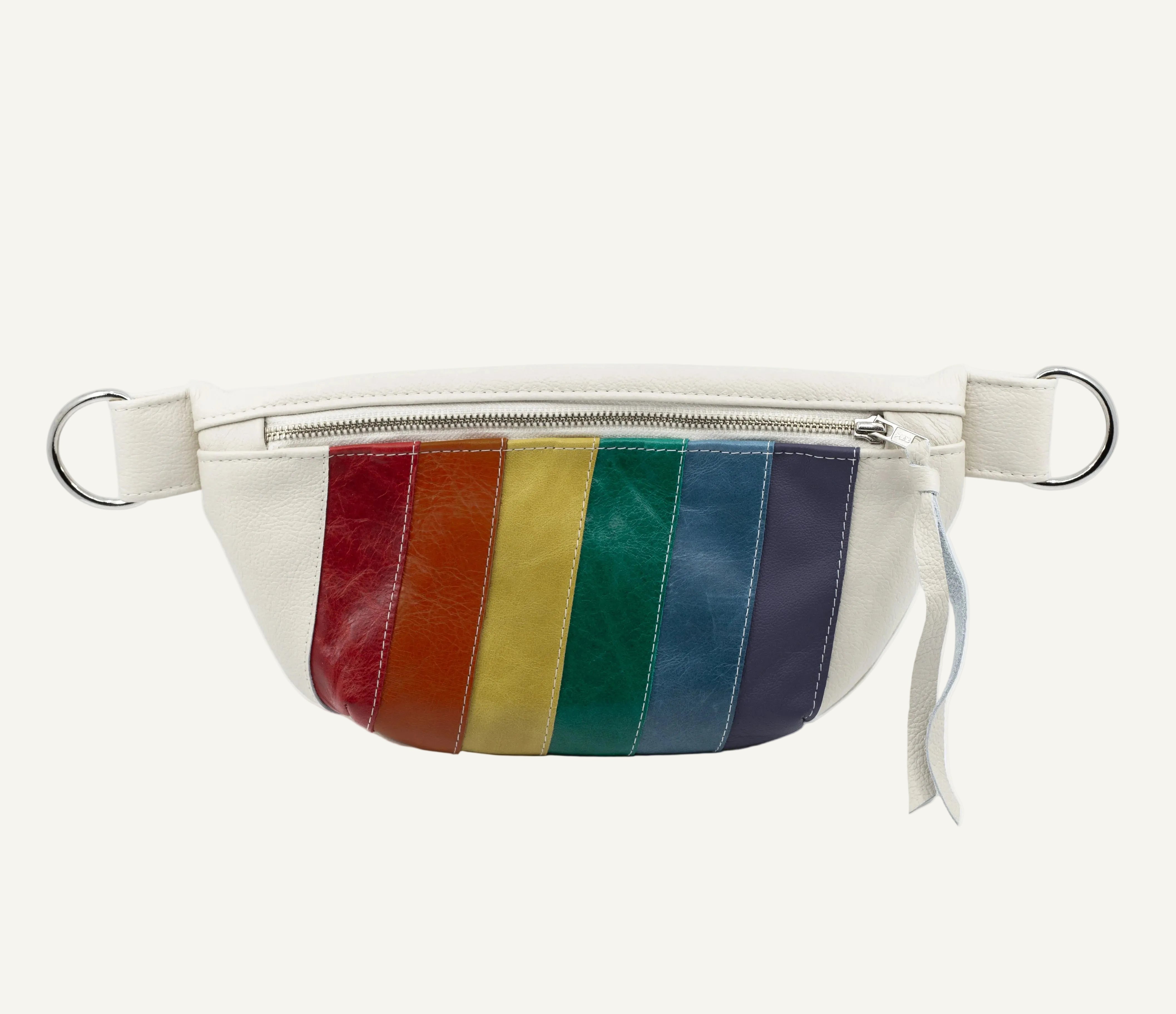 An off-white faux leather fanny pack featuring vertical rainbow-colored stripes on the front, complete with a silver zipper, adjustable strap, and metal D-rings on a white background.