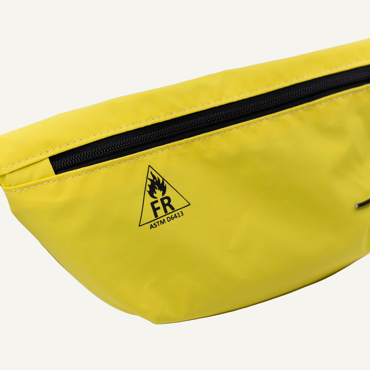 Yellow bag with a black zipper and FR logo on a white background