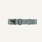 A light gray leather belt with an antique bronze buckle and a matching metal swivel clasp, displayed horizontally on a clean white background.