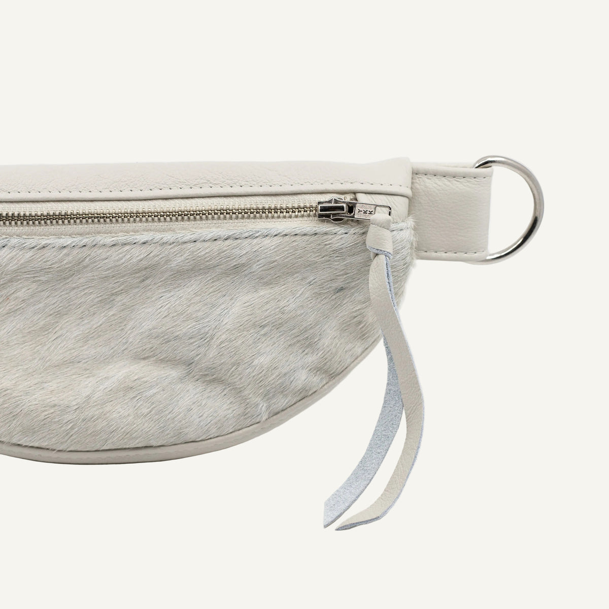White cowhide leather fanny pack with a strap on a white background